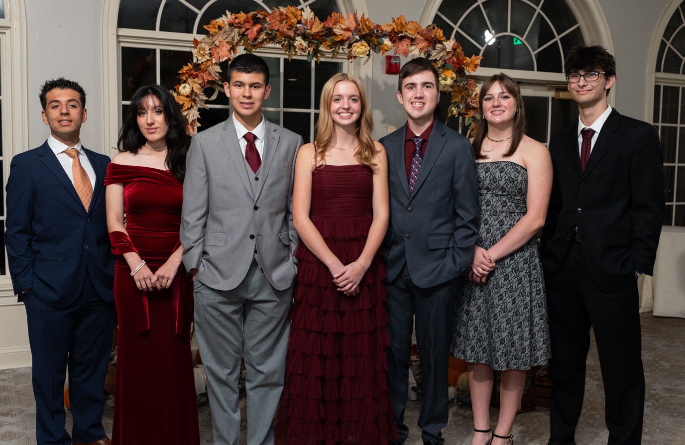 Seven Upper Campus students in formal attire at the school's Protocol event
